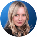 Headshot of a person with long blonde hair against a blue background.